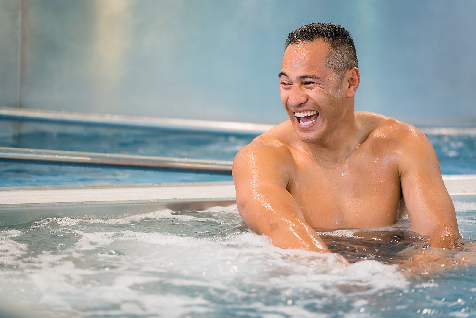 A man laughing in the spa at Jellie Park Rec Centre. 